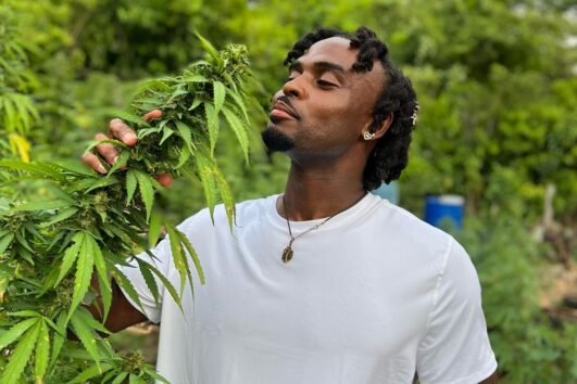 Tourist at Weed Tour Farm in Jamaica with Collins Adventure Tours